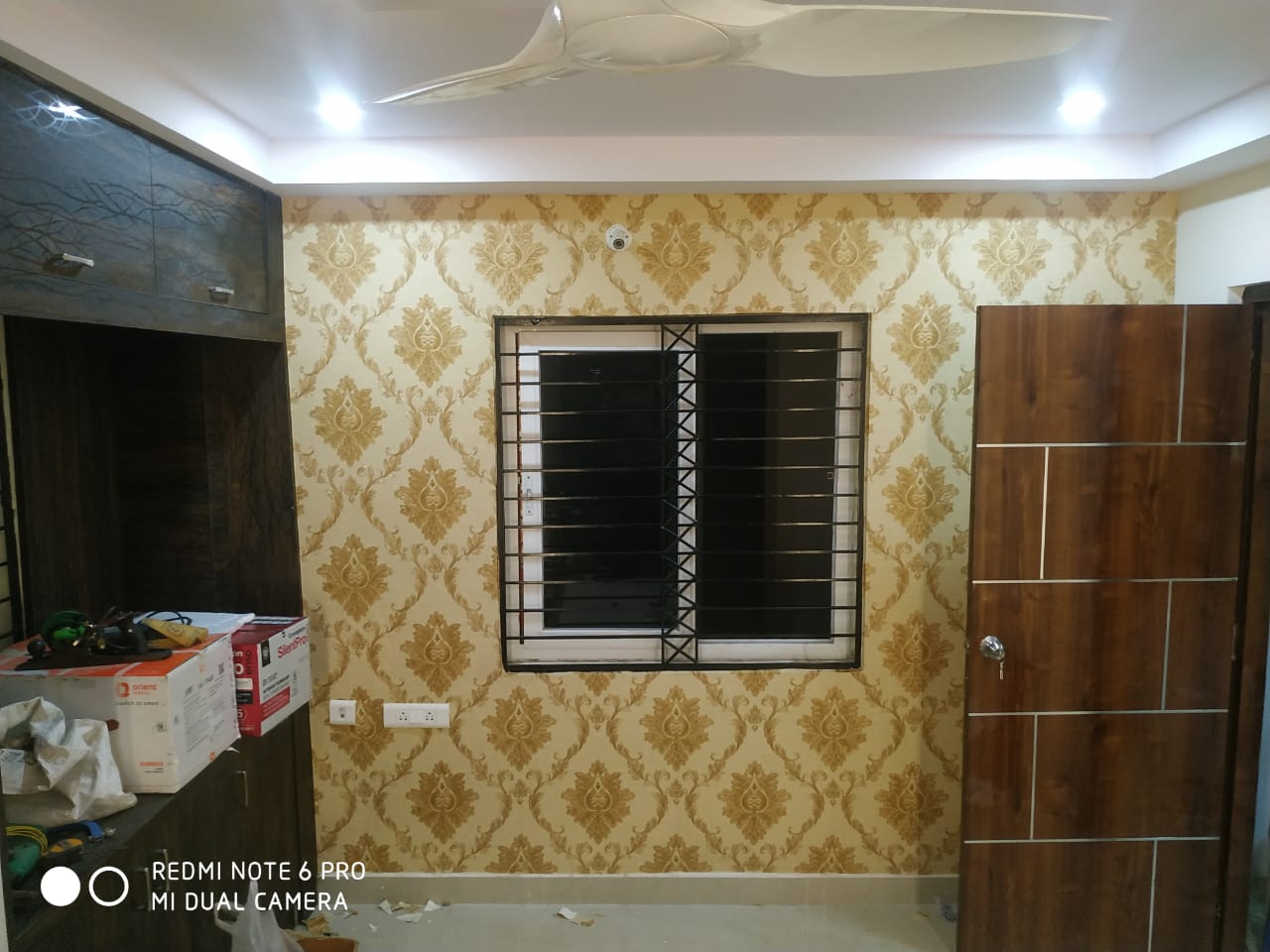 Damask wallpaper bedroom with wardrobe & door in Vizag