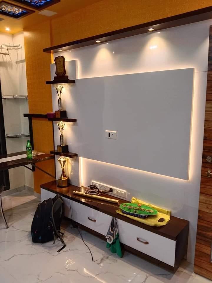 Backlit TV panel with trophy display shelves in Vizag