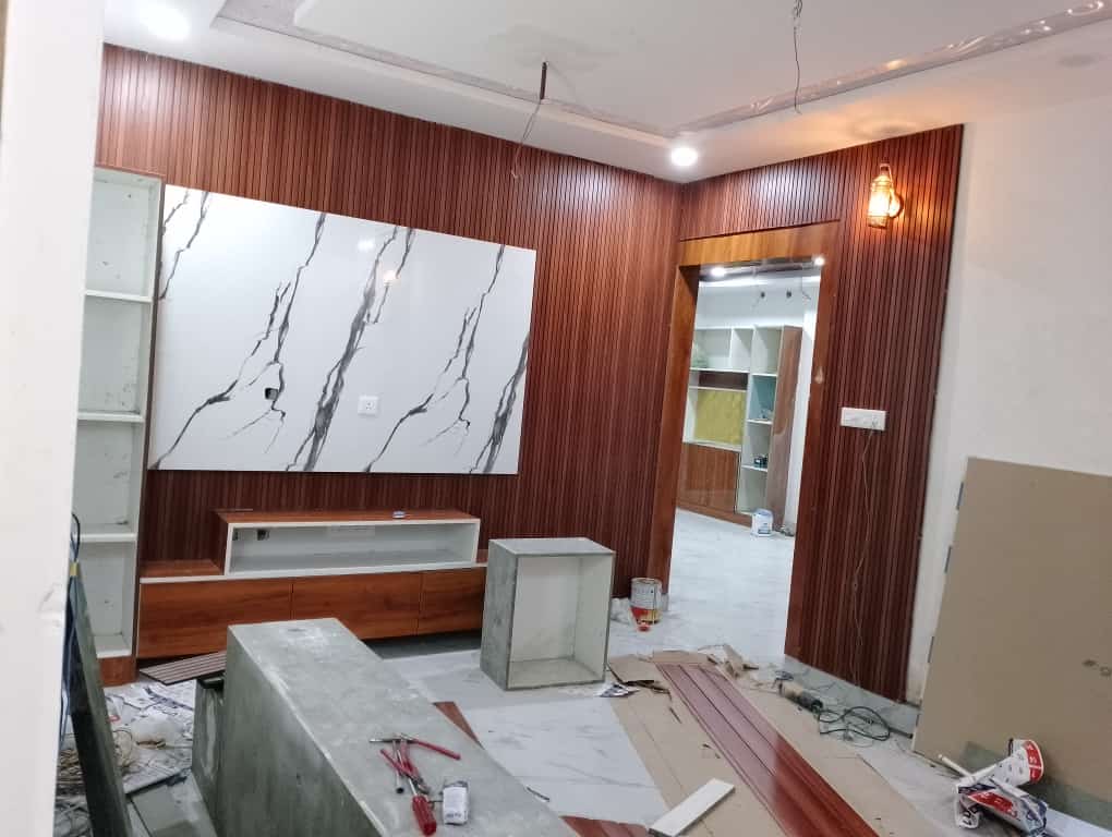 Wooden louver TV wall with marble panel in Vizag